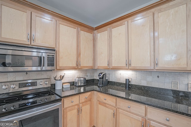 kitchen featuring light brown cabinetry, stainless steel appliances, dark stone countertops, and decorative backsplash