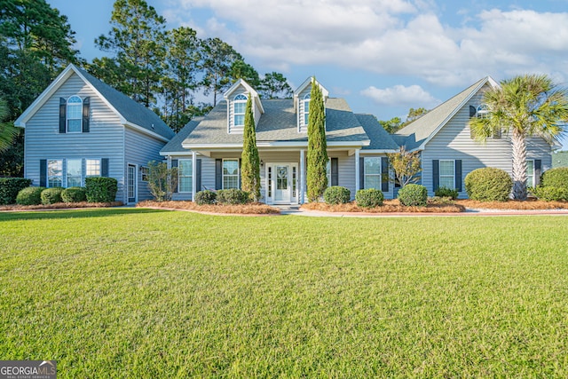 new england style home featuring a front yard