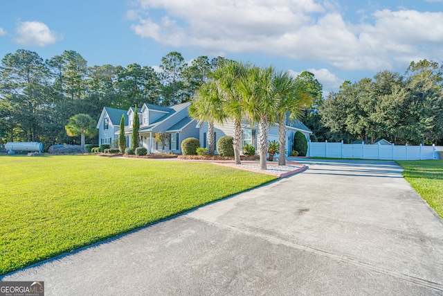 view of front of house with a front yard and a garage