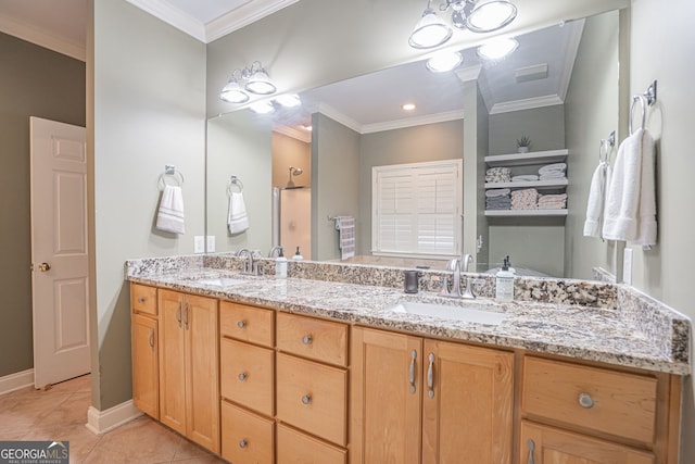 bathroom featuring ornamental molding, vanity, and tile patterned floors