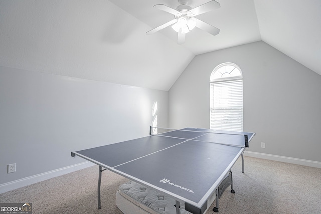 game room with ceiling fan, lofted ceiling, and light carpet