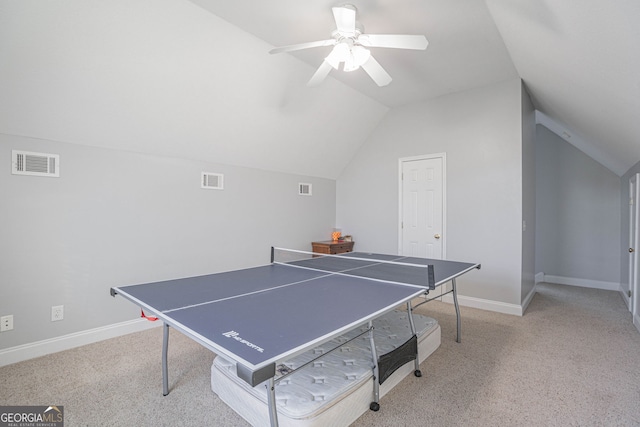 playroom with lofted ceiling, ceiling fan, and light colored carpet