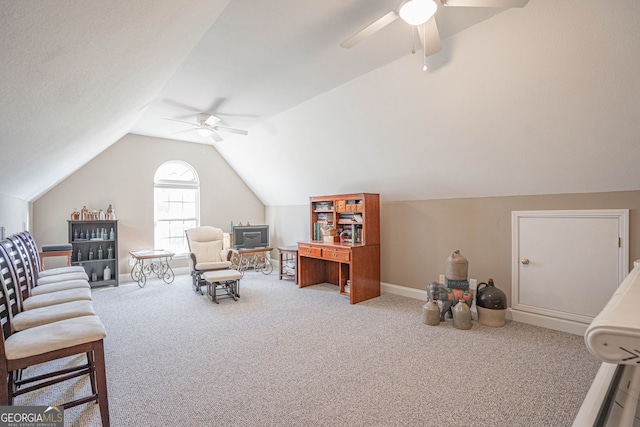 sitting room with lofted ceiling, carpet, and ceiling fan