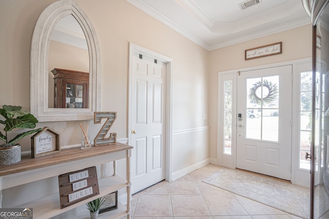 entrance foyer featuring ornamental molding and light tile patterned floors