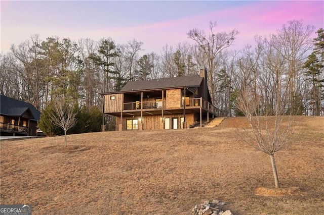 view of front of house with a wooden deck