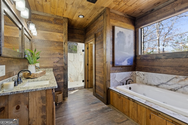 bathroom with independent shower and bath, vanity, wood-type flooring, and wooden ceiling