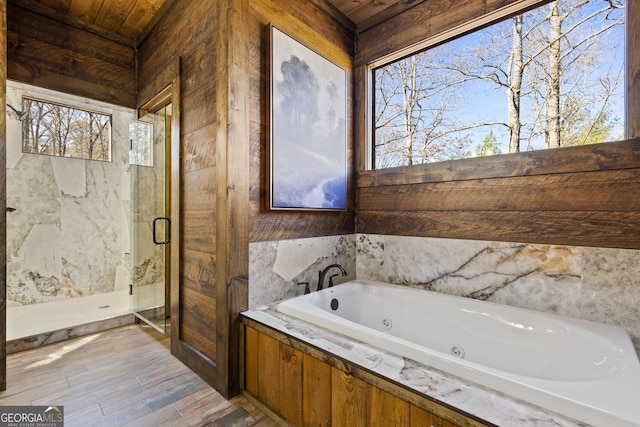 bathroom featuring shower with separate bathtub, wooden ceiling, and a healthy amount of sunlight