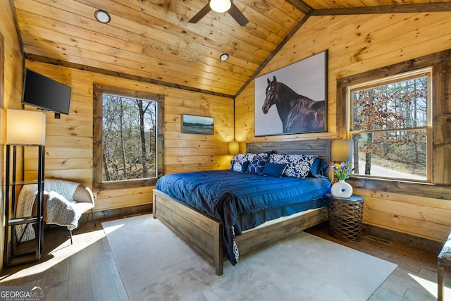 bedroom with ceiling fan, wood ceiling, vaulted ceiling, and multiple windows