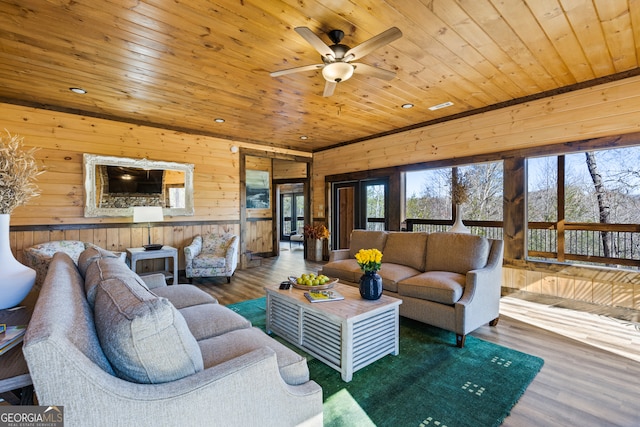 living room with wood ceiling, wood walls, and dark wood-type flooring