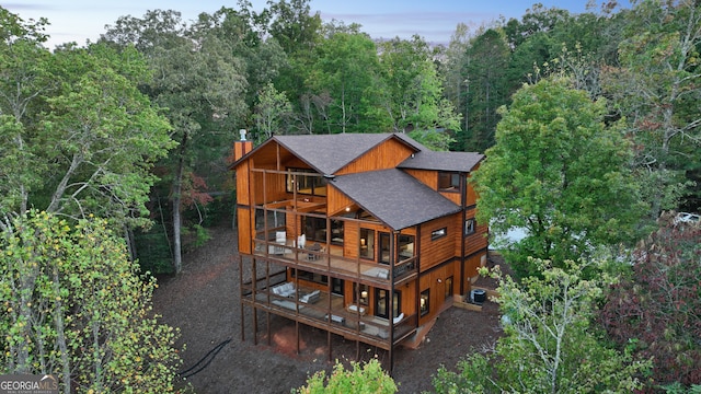 back of house with a balcony