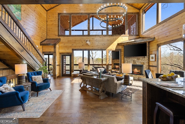 living room with high vaulted ceiling and a healthy amount of sunlight