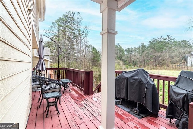 wooden deck featuring area for grilling