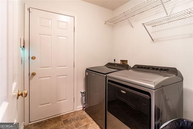 laundry area with separate washer and dryer