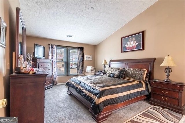 bedroom featuring light carpet, lofted ceiling, and a textured ceiling