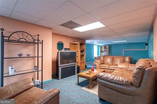 carpeted living room featuring a paneled ceiling