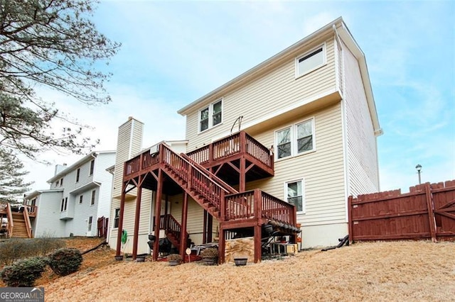 back of property featuring a deck