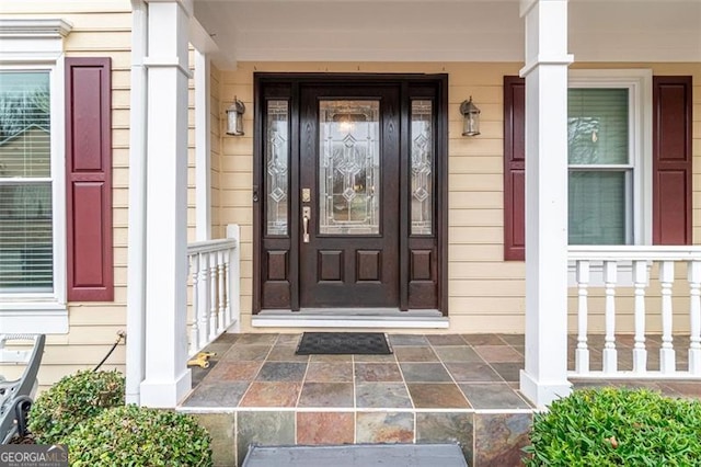 property entrance featuring covered porch