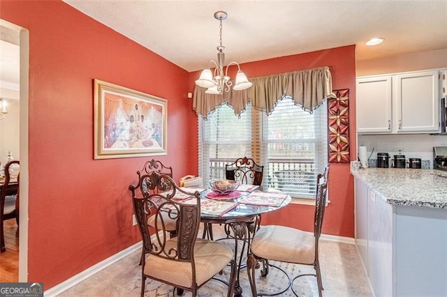 dining area featuring an inviting chandelier