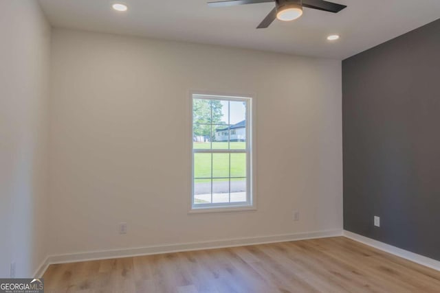 spare room with ceiling fan and light hardwood / wood-style floors