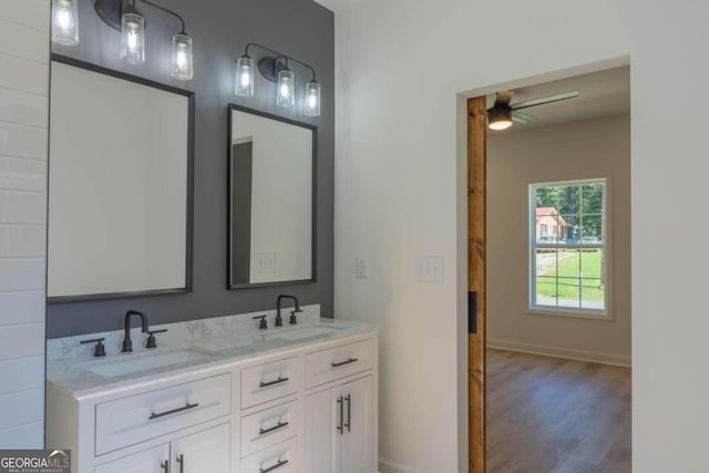 bathroom with ceiling fan, hardwood / wood-style flooring, and vanity