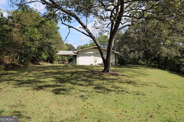 view of yard with a garage