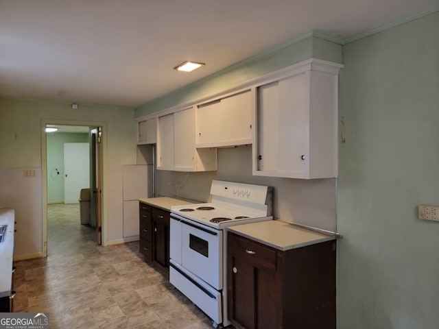 kitchen with electric stove, dark brown cabinets, and white cabinetry