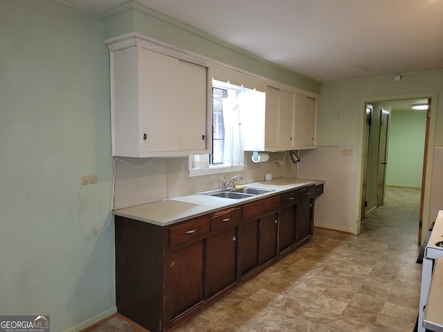 kitchen featuring dark brown cabinets and sink