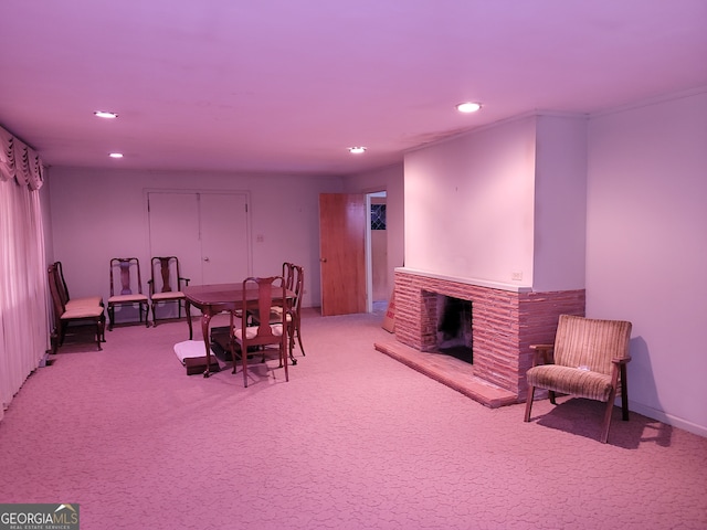 sitting room with a fireplace and carpet flooring