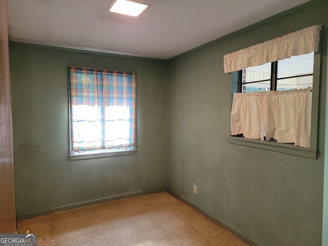 carpeted empty room featuring a healthy amount of sunlight