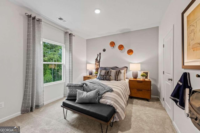 bedroom with light colored carpet