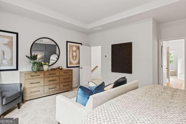 bedroom with light colored carpet