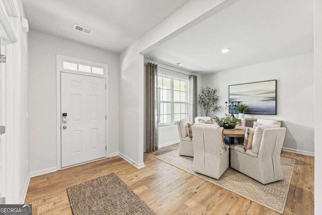 foyer entrance with light hardwood / wood-style flooring