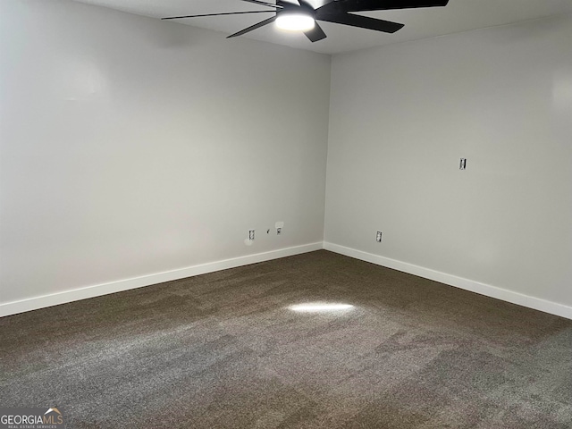 spare room featuring ceiling fan and carpet