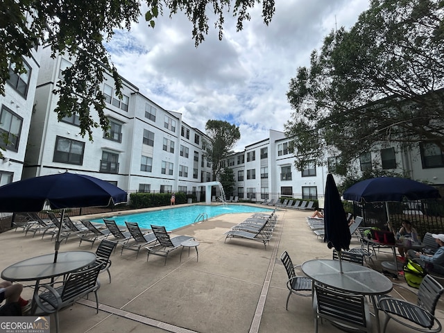 view of swimming pool with a patio area