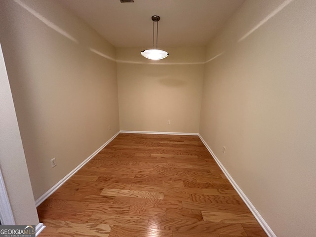 unfurnished room featuring wood-type flooring