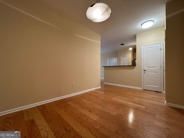 unfurnished room featuring light hardwood / wood-style flooring