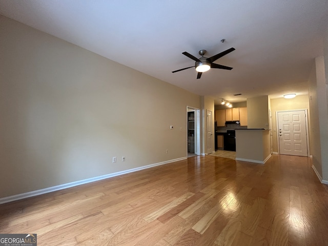 unfurnished living room with light wood-type flooring and ceiling fan