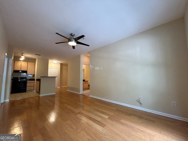 unfurnished living room with light hardwood / wood-style floors and ceiling fan