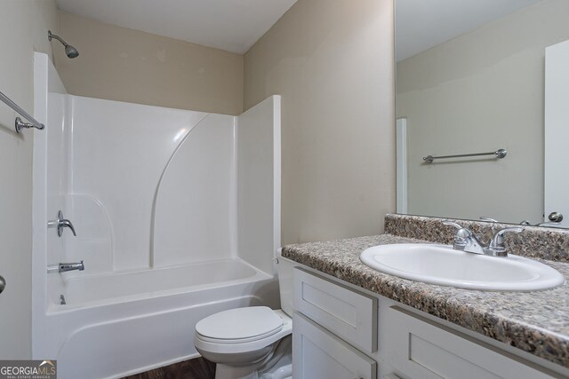 full bathroom featuring vanity, shower / bath combination, and toilet