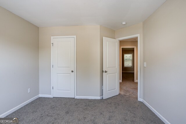 unfurnished bedroom featuring carpet floors