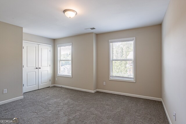 spare room with carpet flooring