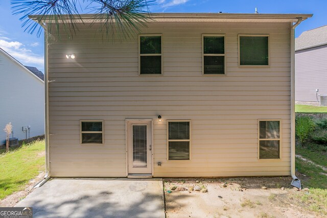 rear view of property with a patio area