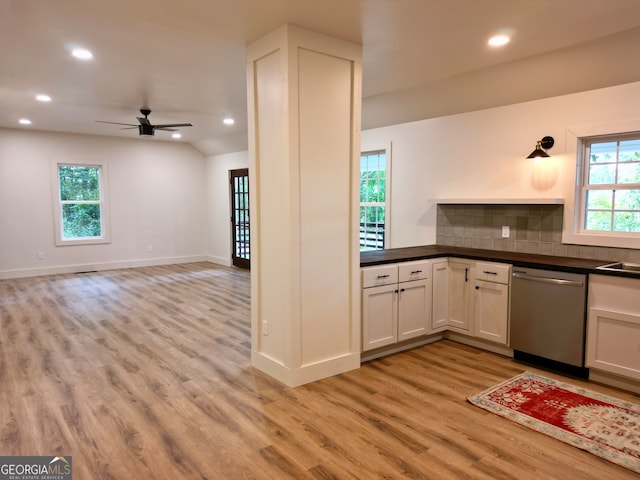 kitchen with white cabinets, plenty of natural light, and stainless steel dishwasher