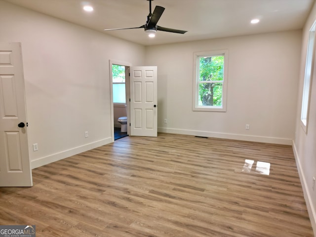 unfurnished room with ceiling fan and light hardwood / wood-style floors