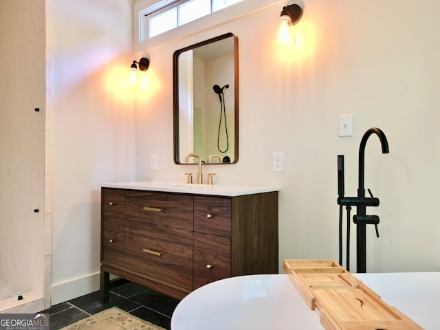 bathroom featuring vanity, a shower, and tile patterned floors