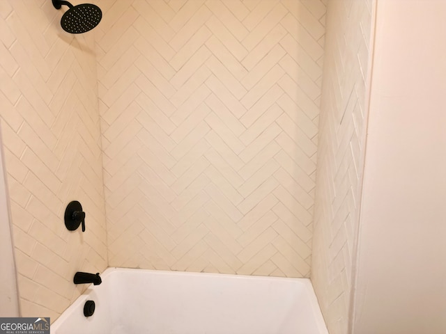 interior details with tiled shower / bath