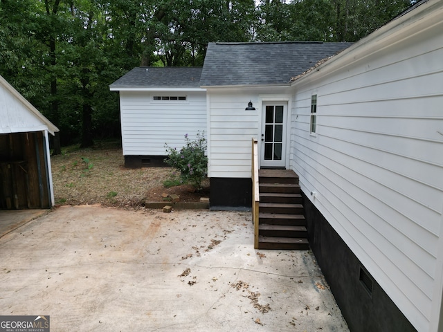 view of patio featuring an outbuilding