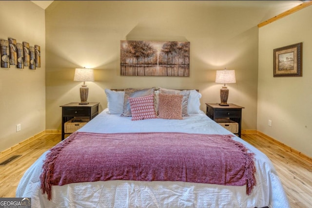 bedroom with wood-type flooring