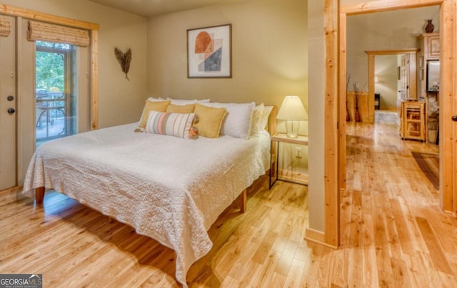 bedroom with hardwood / wood-style flooring