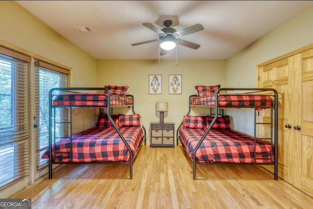 bedroom with hardwood / wood-style floors and ceiling fan